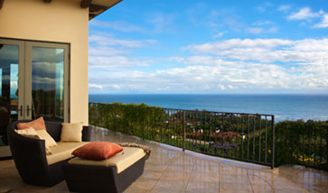 view from balcony overlooking town and ocean